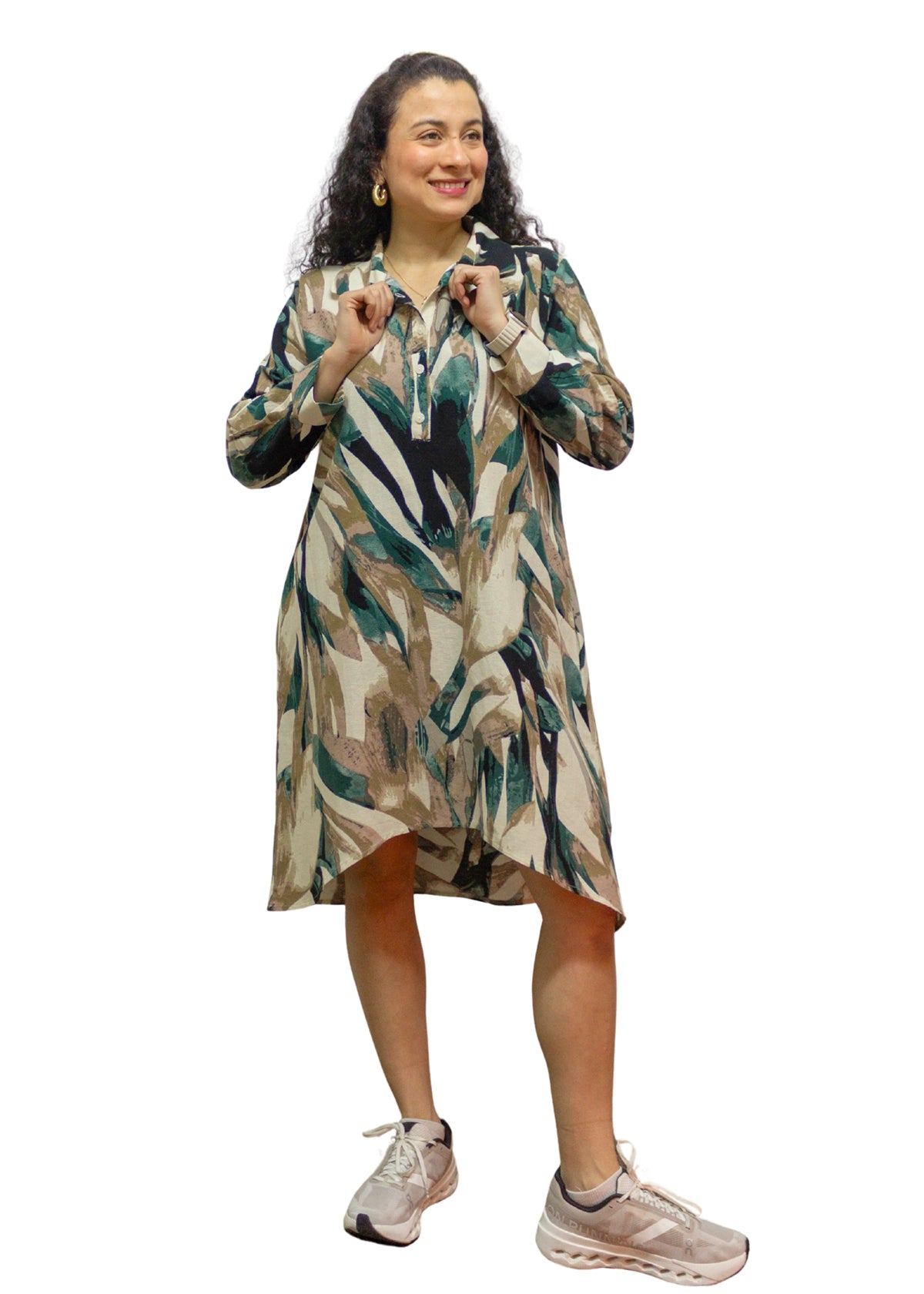 Woman wearing a patterned dress on a white background