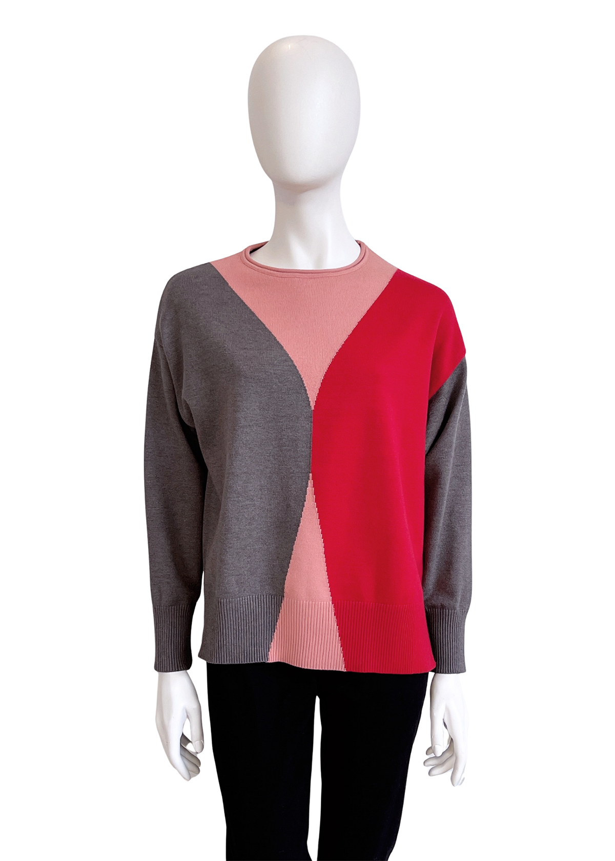 Mannequin wearing a sweater with a geometric color block design on a white background