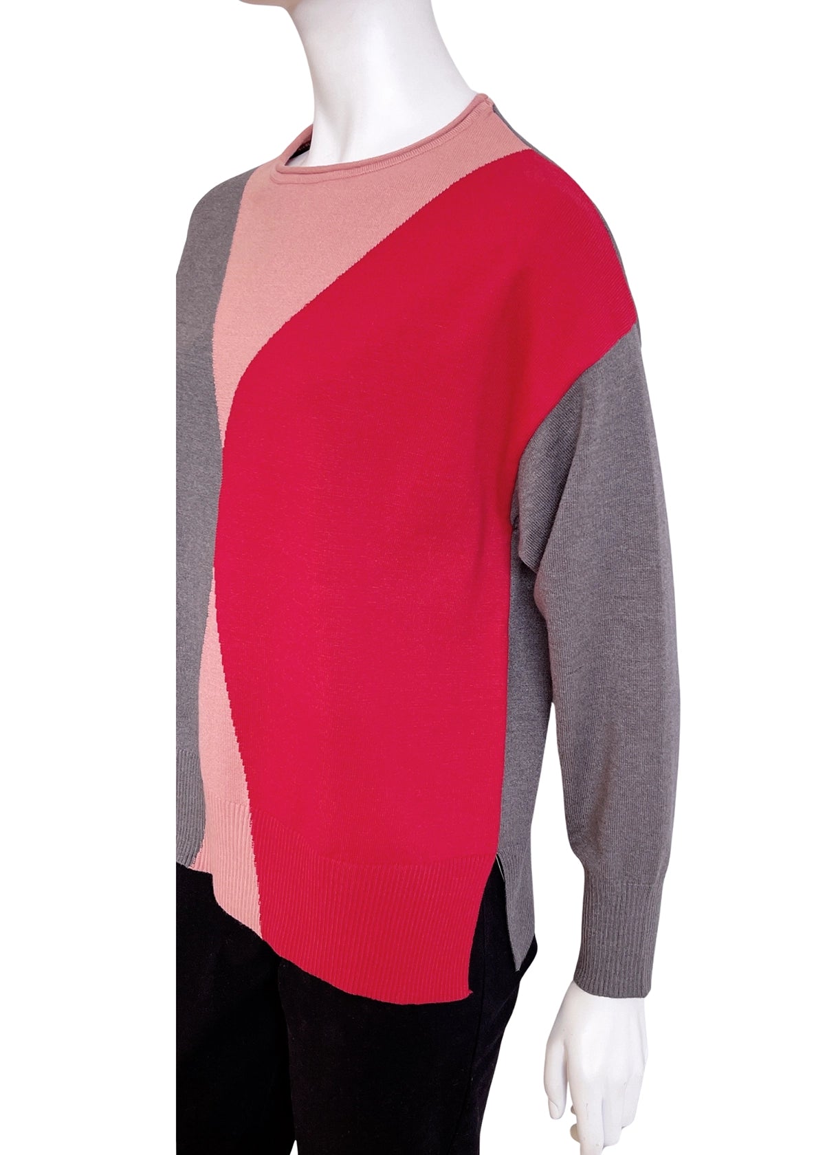 Color-blocked sweater on a mannequin against a white background