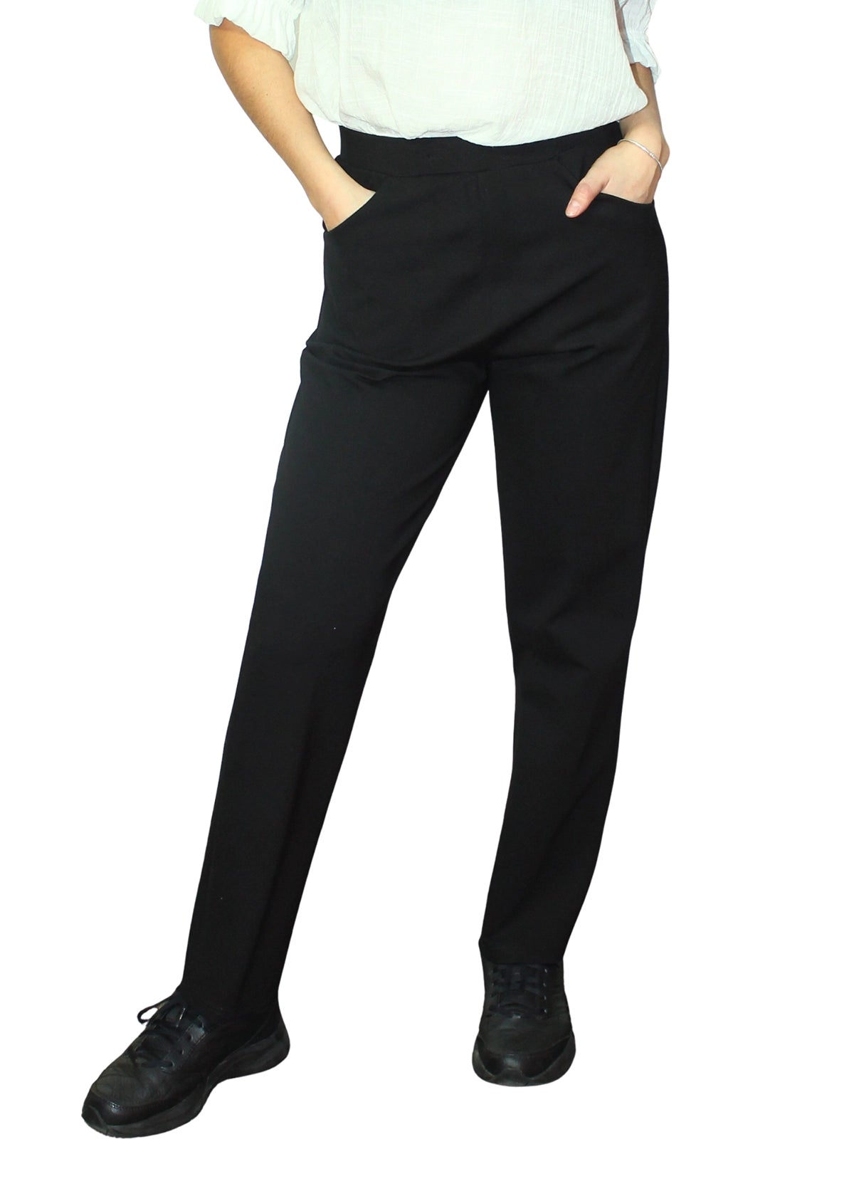 Person wearing black pants on a white background