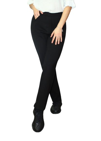 Person wearing black pants on a white background