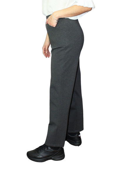 Person wearing a gray skirt with a white shirt on a white background
