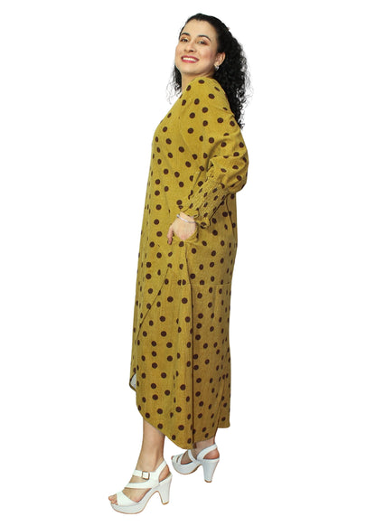 Woman wearing a yellow dress with black polka dots on a white background
