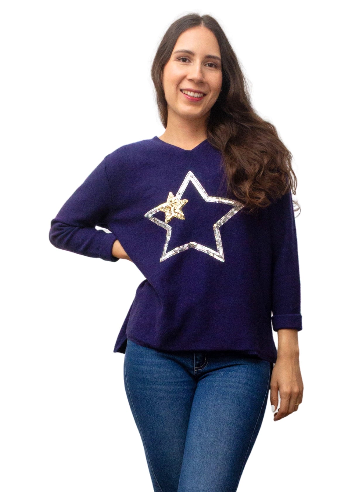 Woman wearing a navy sweater with a large star design on a white background
