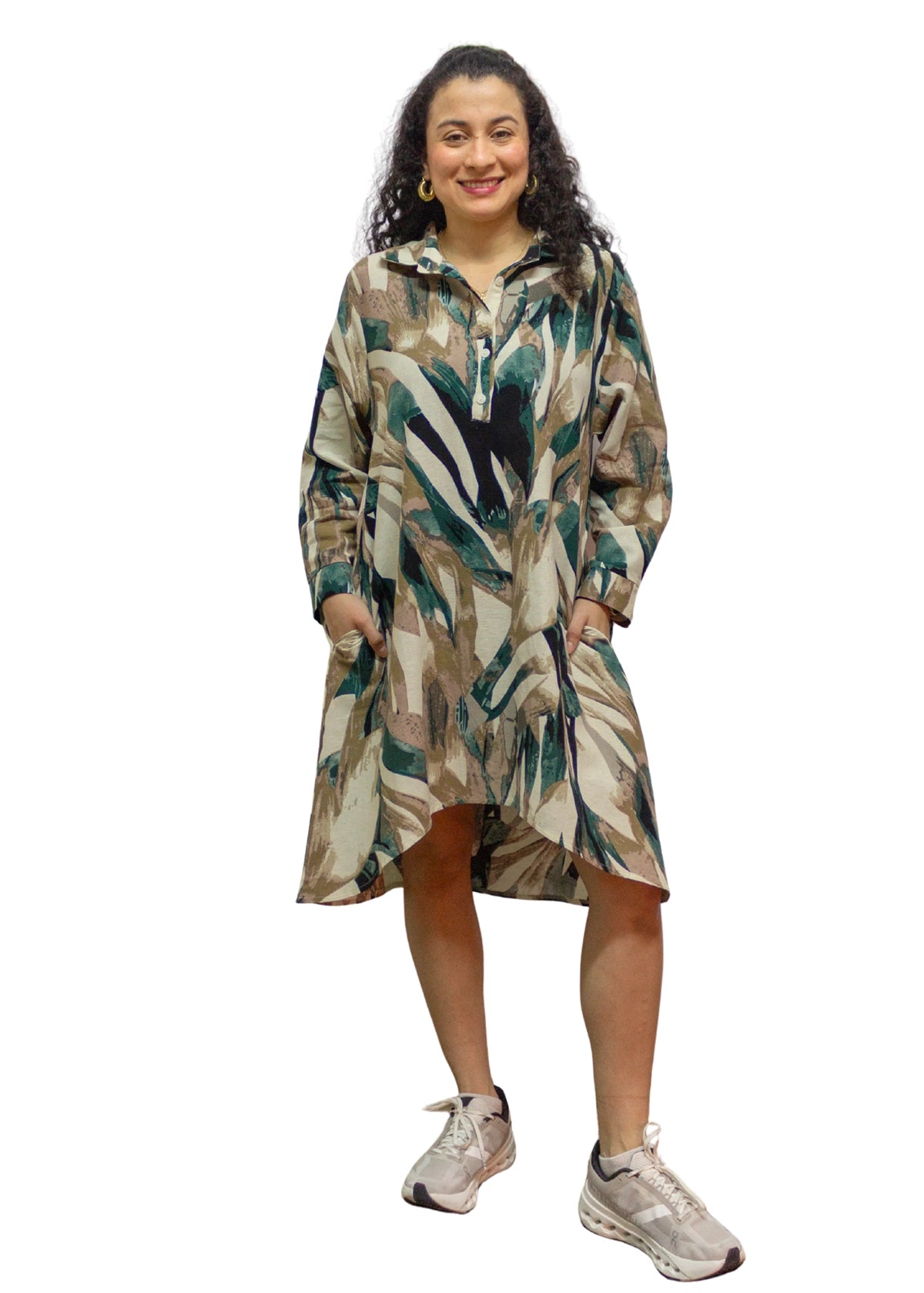 Woman wearing a patterned dress on a white background