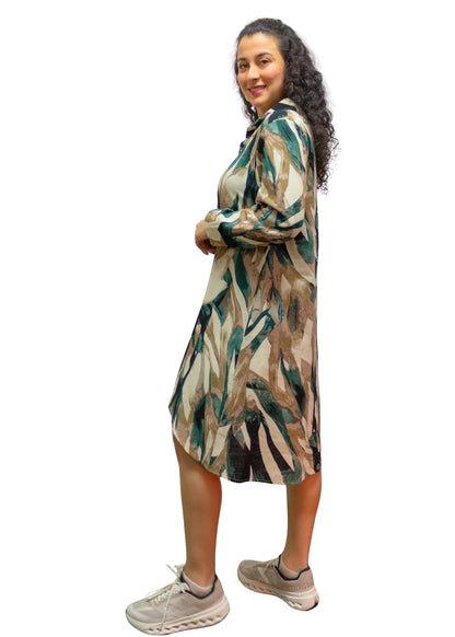 Woman wearing a patterned dress on a white background