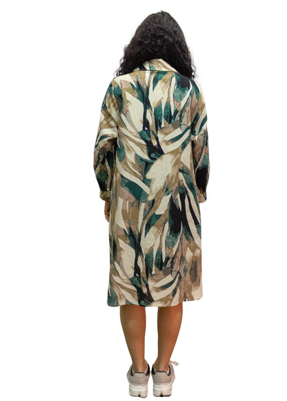Person wearing a long, patterned coat on a white background