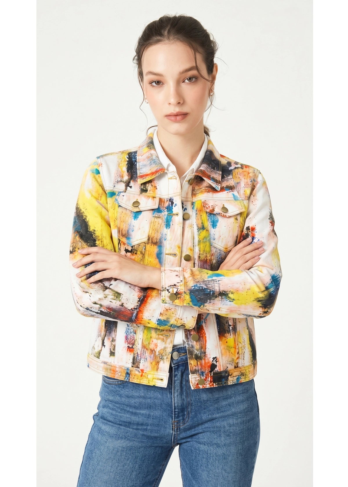Woman wearing a colorful jacket with abstract patterns on a white background