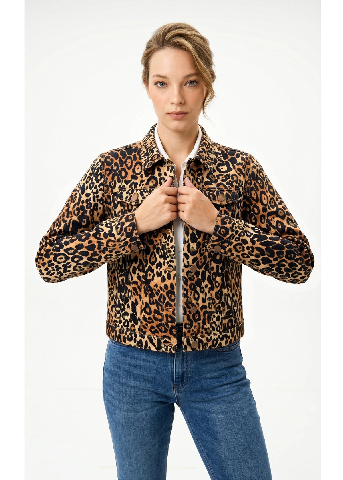 Person wearing a leopard print jacket and blue jeans on a white background