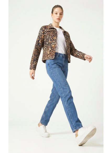 Woman wearing a leopard print jacket, white shirt, blue jeans, and white sneakers on a white background