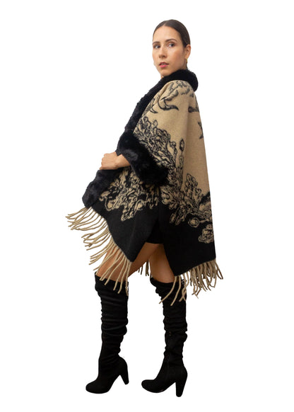 Woman wearing a black and beige patterned scarf with fringes on a white background