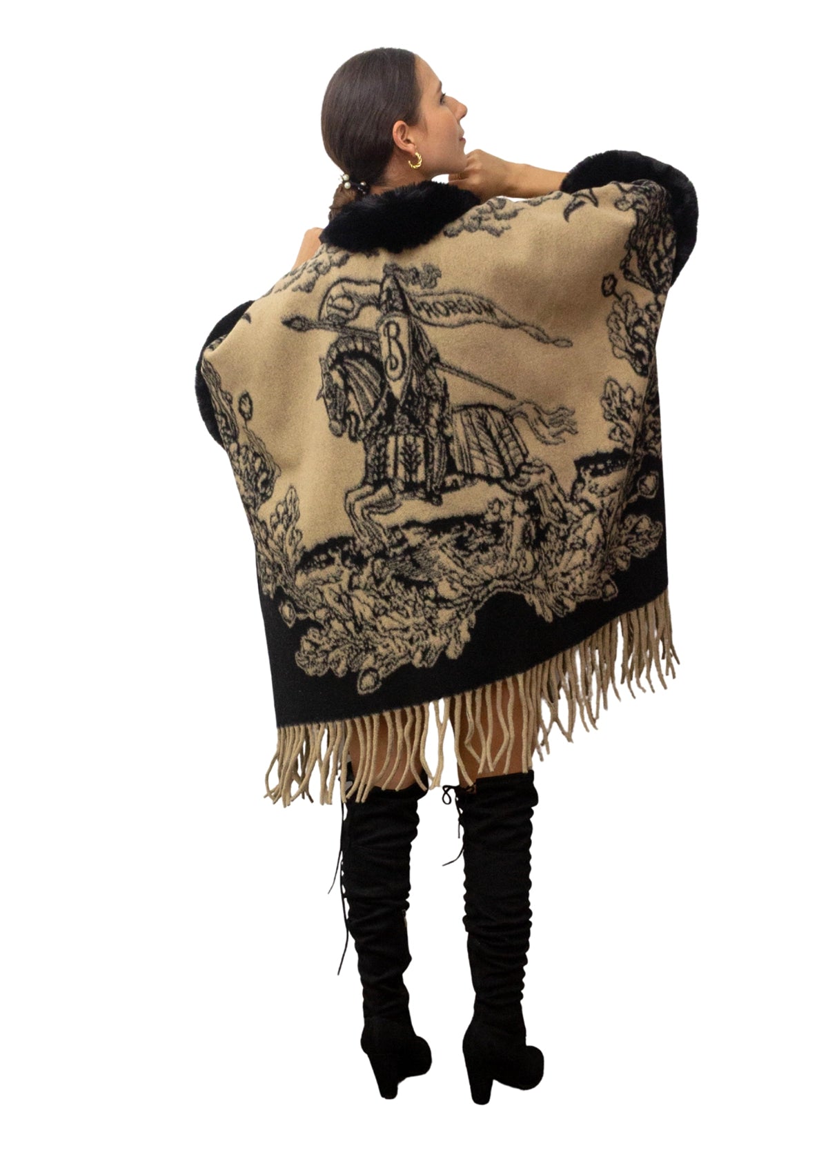 Woman wearing a decorative shawl with fringe on a white background
