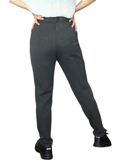 Person wearing dark gray pants on a white background